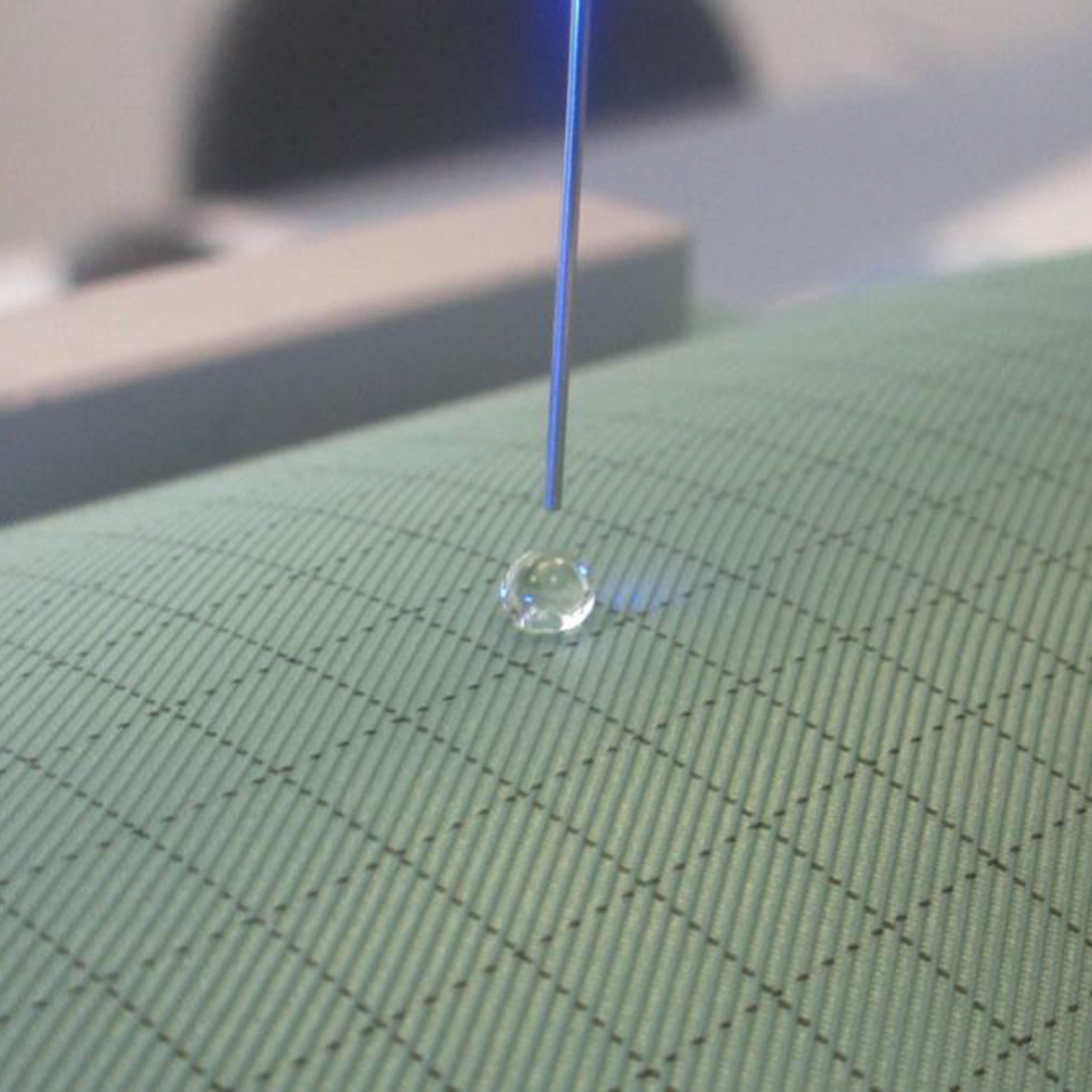 Droplet on the textile sample © OHB